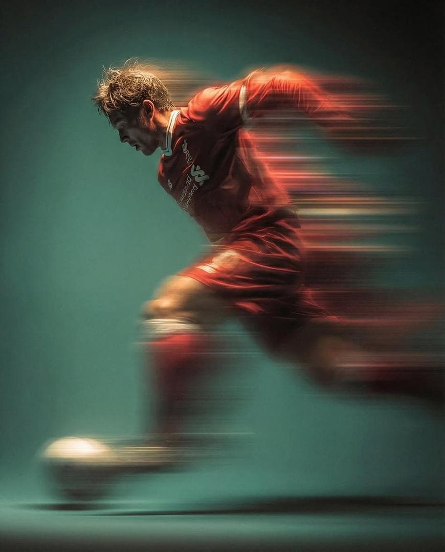 Panning shot of a mysterious soccer player in red proffesional soccer jearsy mid air kicking a ball, motion blur, cinematic lighting agains a Light gree…