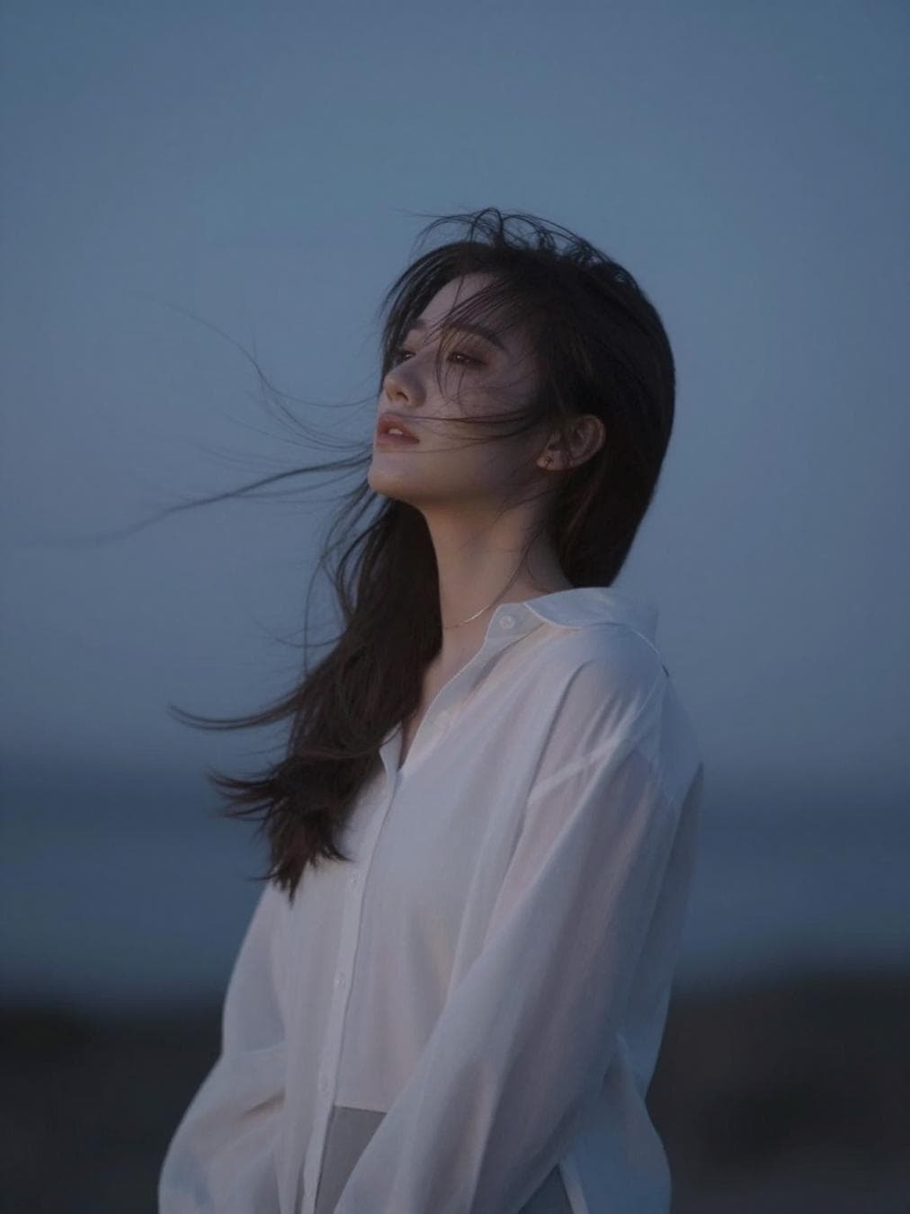 Character reacting deeply to surroundings—wind, music, silence. Emotional aura…