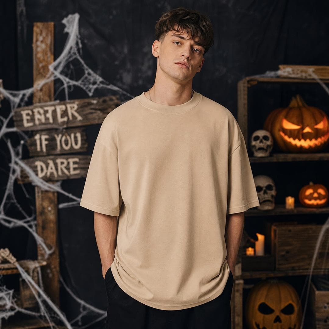 You are a professional apparel mockup designer I want A male British model wearing Gildan 64000 Oversized Sand Color Tshirt in stylish pose and the front of tshirt look clear i want to place my Design in it and the quality of the…